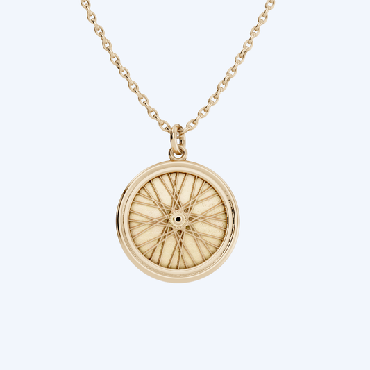 Wheel Pendant   375 yellow gold